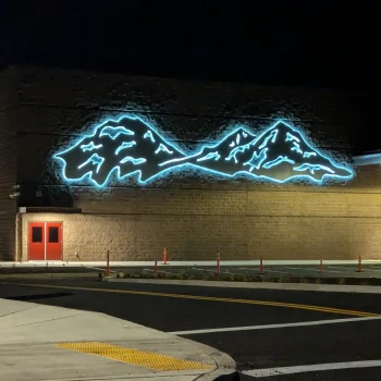 Photograph of Sisters Elementary School's Entrance at night.